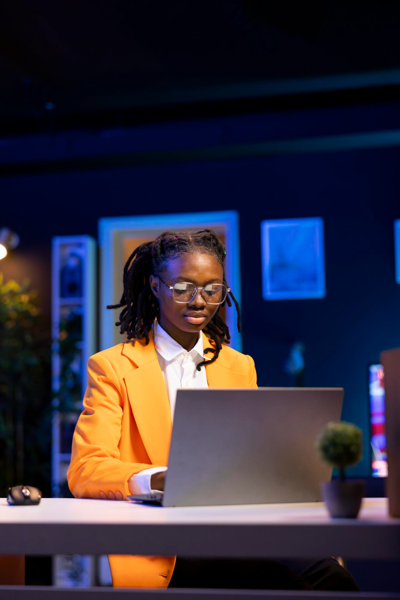 FirstHomes Africa staff member managing member applications on a laptop